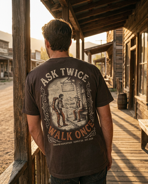 Ask Twice. Walk Once. tee worn on a general store porch, back print